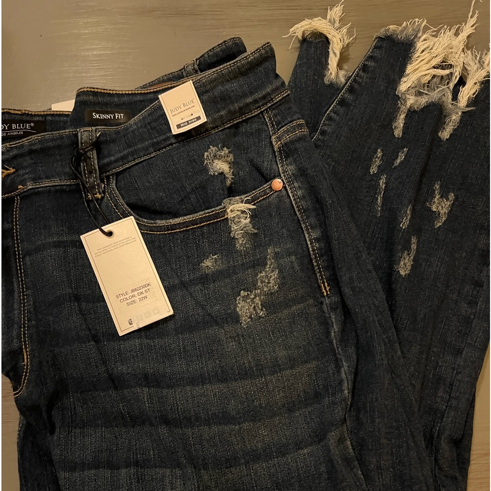 BNWT Judy, blue skinny fit distressed denim with shark bite hem